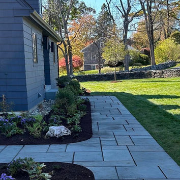 Bark mulched garden bed beside a walkway